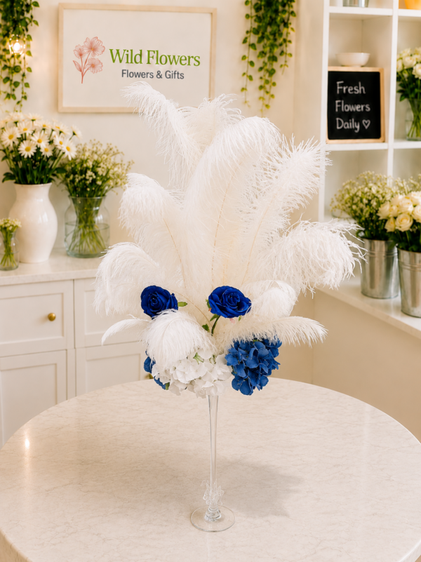 Artificial Feather Arrangement with white feathers and blue flowers in Dubai