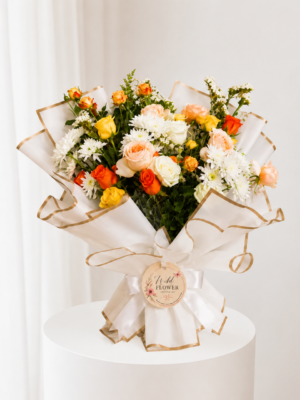 Ivory Apricot Bouquet with white and orange flowers in elegant wrapping