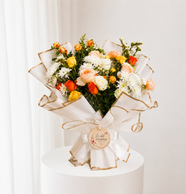 Ivory Apricot Bouquet with white and orange flowers in elegant wrapping Ivory Apricot Bouquet with white and orange flowers in elegant wrapping