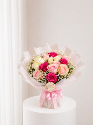 Peach Rose Bouquet with pink cream and peach roses in elegant wrapping