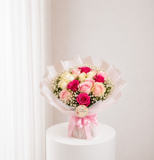 Peach Rose Bouquet with pink cream and peach roses in elegant wrapping