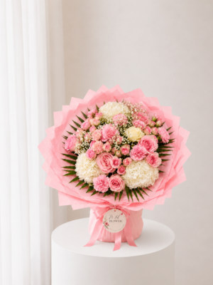 Pink Garden Bouquet with fresh pink roses cream flowers and elegant pink wrapping