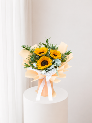 Radiant Sunflower Bouquet with fresh yellow sunflowers greenery and elegant cream wrapping Radiant Sunflower Bouquet with fresh yellow sunflowers greenery and elegant cream wrapping