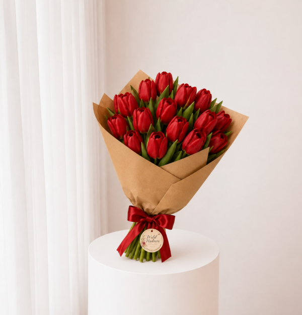 Ruby Tulip Bouquet with fresh red tulips kraft wrapping and red ribbon Ruby Tulip Bouquet with fresh red tulips kraft wrapping and red ribbon