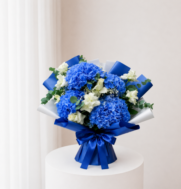 Blue Hydrangea Bouquet with white flowers greenery and blue wrapping Blue Hydrangea Bouquet with white flowers greenery and blue wrapping
