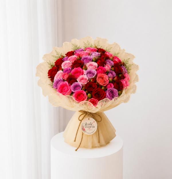 Ruby Rose Bouquet with red and pink roses in cream wrapping Ruby Rose Bouquet with red and pink roses in cream wrapping