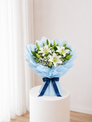 White Lily Bouquet with fresh white lilies and blue wrapping White Lily Bouquet with fresh white lilies and blue wrapping