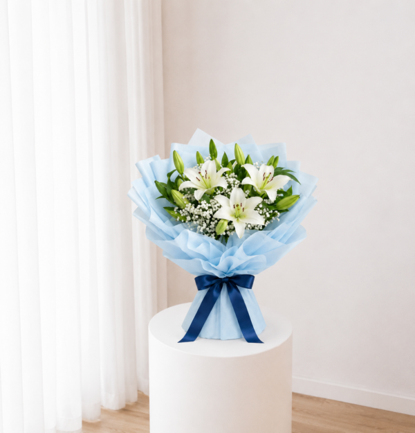 White Lily Bouquet with fresh white lilies and blue wrapping White Lily Bouquet with fresh white lilies and blue wrapping