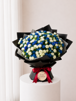 Midnight Blue Bouquet with blue and white flowers in black wrapping