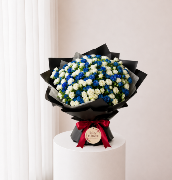 Midnight Blue Bouquet with blue and white flowers in black wrapping