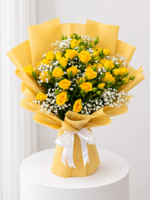 Yellow rose bouquet with baby’s breath in yellow wrapping paper and white ribbon Yellow rose bouquet with baby’s breath in yellow wrapping paper and white ribbon
