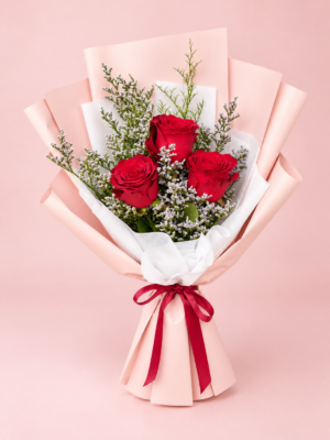 3 Red Roses Dubai bouquet with white fillers pink wrapping and red ribbon 3 Red Roses Dubai bouquet with white fillers pink wrapping and red ribbon