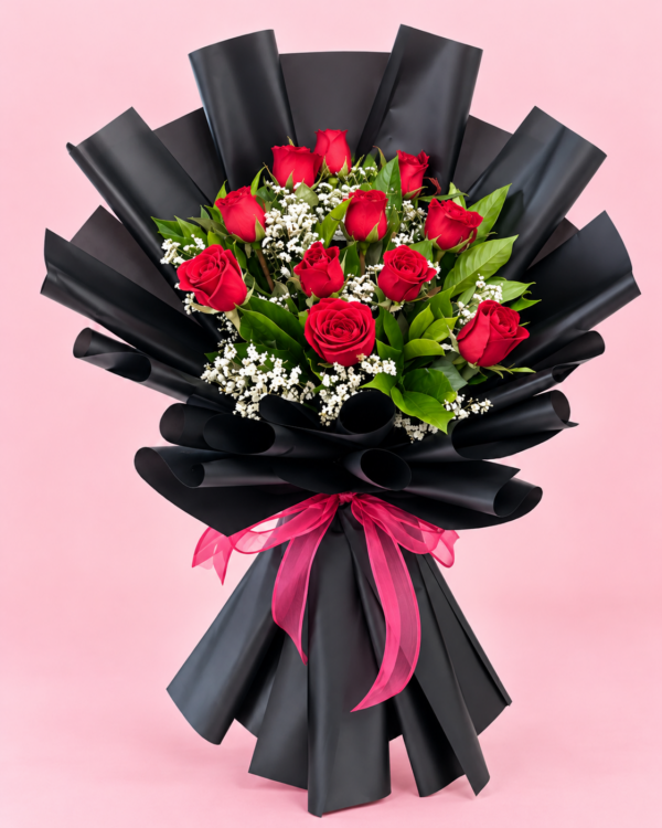 Black Wrapped Roses Dubai with fresh red roses baby’s breath and pink ribbon